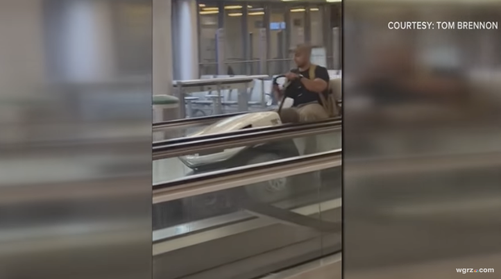 Wyoming man driving golf cart in airport terminal